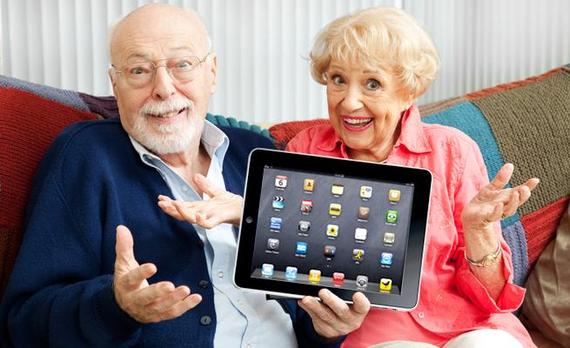 Seniors holding tablet